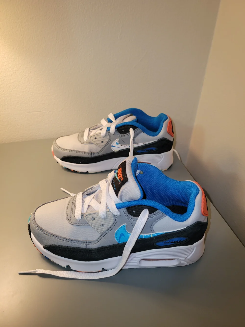 Nike AirMax90 Kids White and Gray Sneakers with Blue and Orange Accents